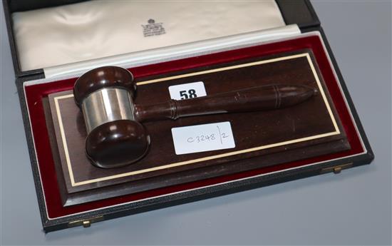 A Garrard silver mounted ceremonial gavel and stand, case stand width 28cm